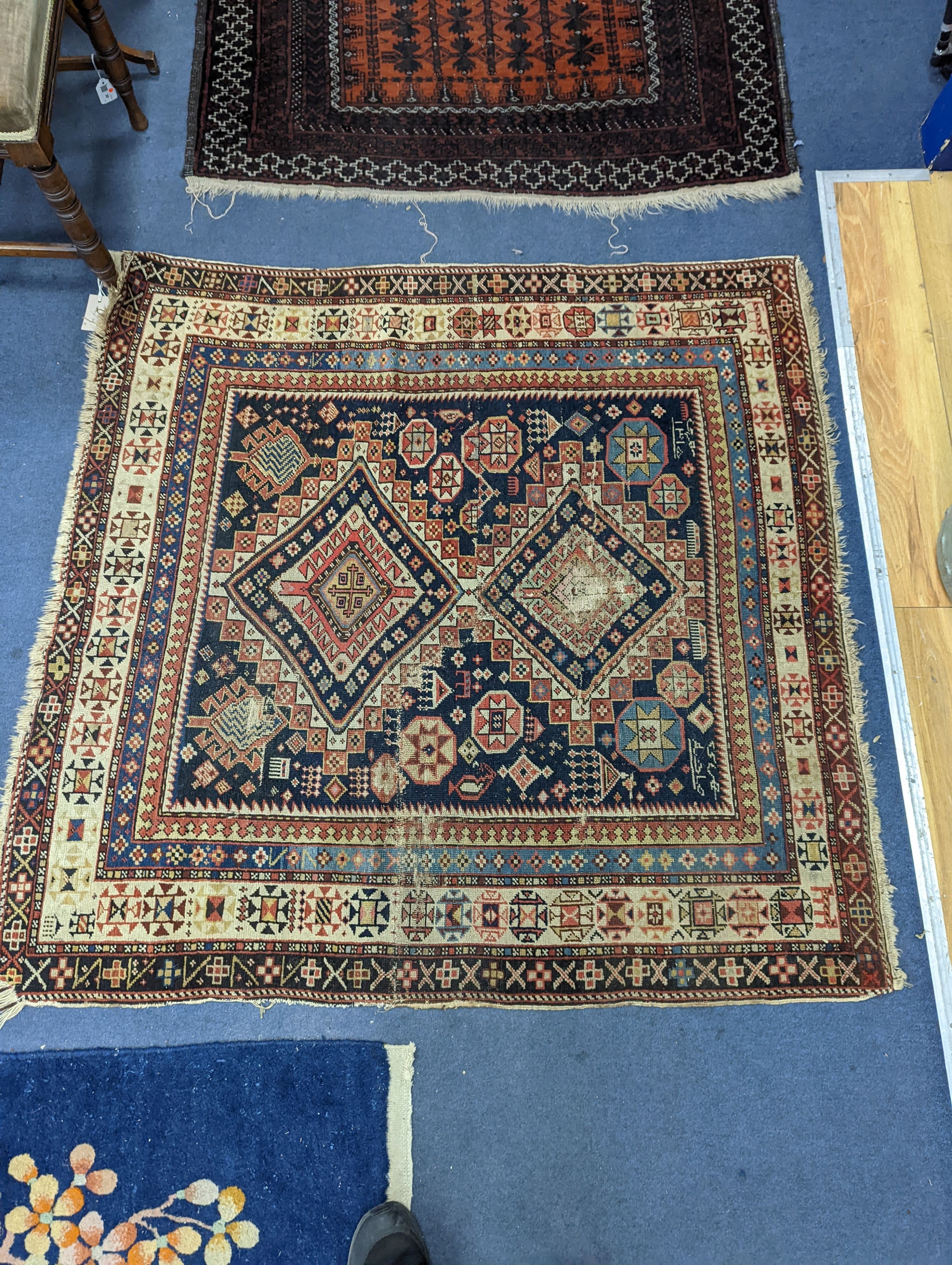 An antique Shirvan rug, signed and dated 1895, 124 x 121cm